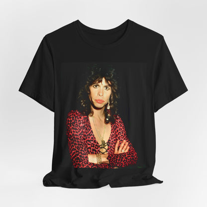 A black graphic t-shirt featuring a vintage 70s-inspired design with Aerosmith branding, incorporating a prominent leopard print pattern.