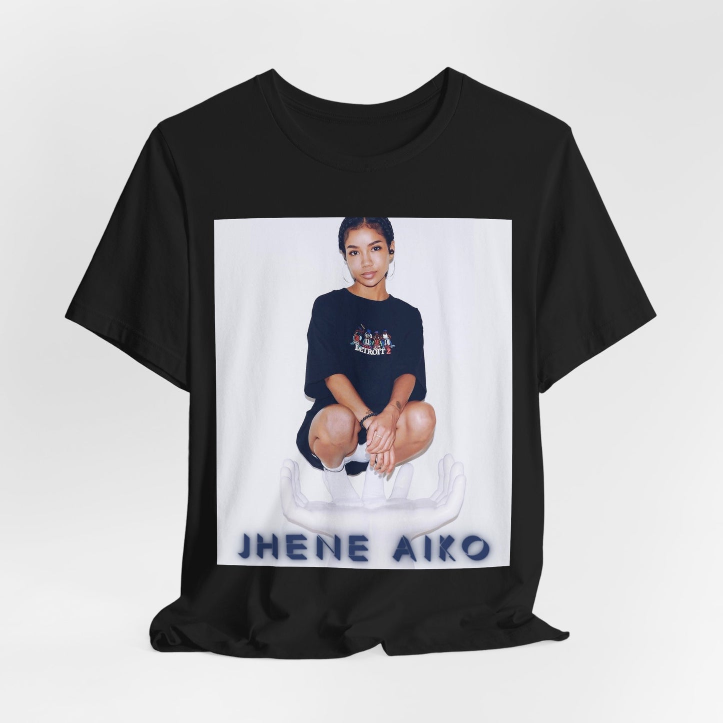 A black graphic t-shirt featuring a casual R&B fan graphic of Jhene Aiko.