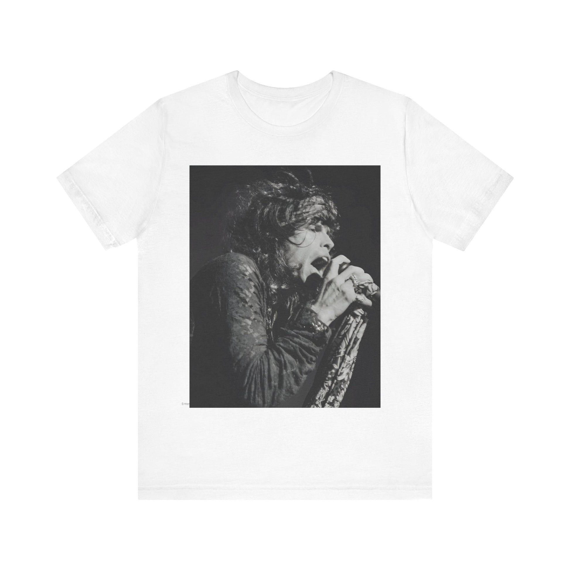 A black graphic t-shirt featuring a retro 70s-style illustration or photo of Aerosmith, designed to evoke their 'On Tour' presence, possibly with band members on stage or tour bus imagery.