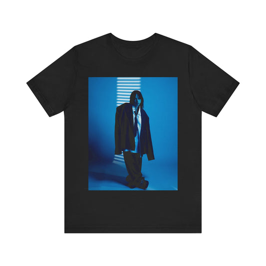 A high-fashion, editorial-style photo of Billie Eilish, embodying a 'breaking the rules' attitude, printed on a graphic t-shirt.