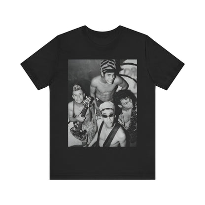 A black graphic t-shirt featuring an 80s vintage funk rock graphic of Red Hot Chili Peppers.