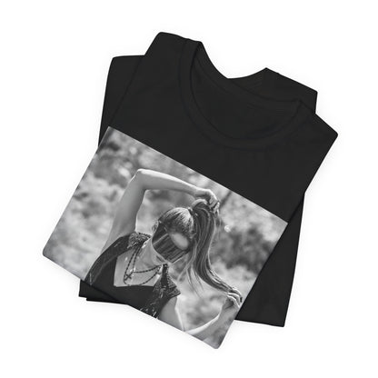 A black graphic t-shirt featuring a black and white, monochrome graphic or photo of Shakira.