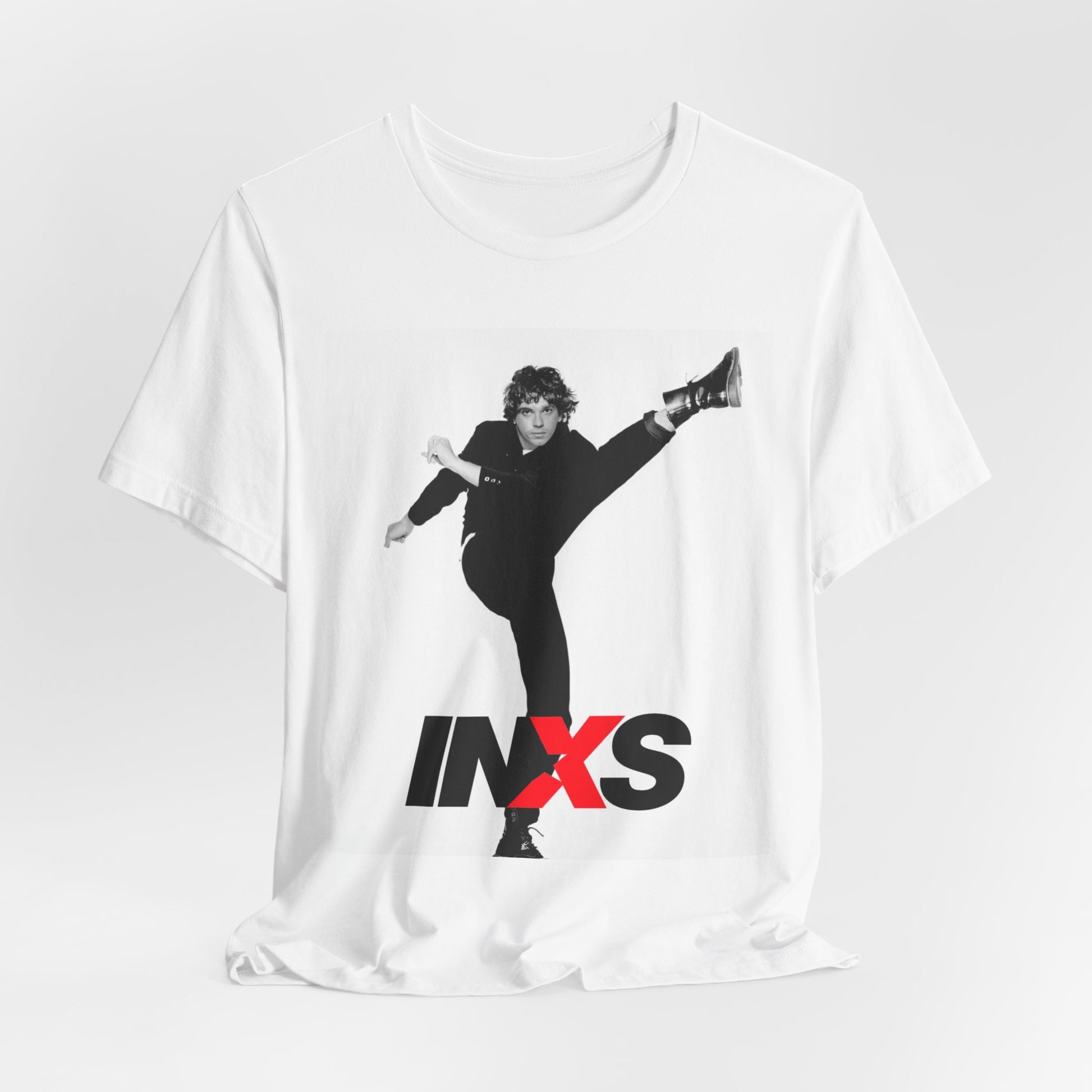 A black graphic t-shirt featuring a retro graphic related to INXS's 'Kick' album era.