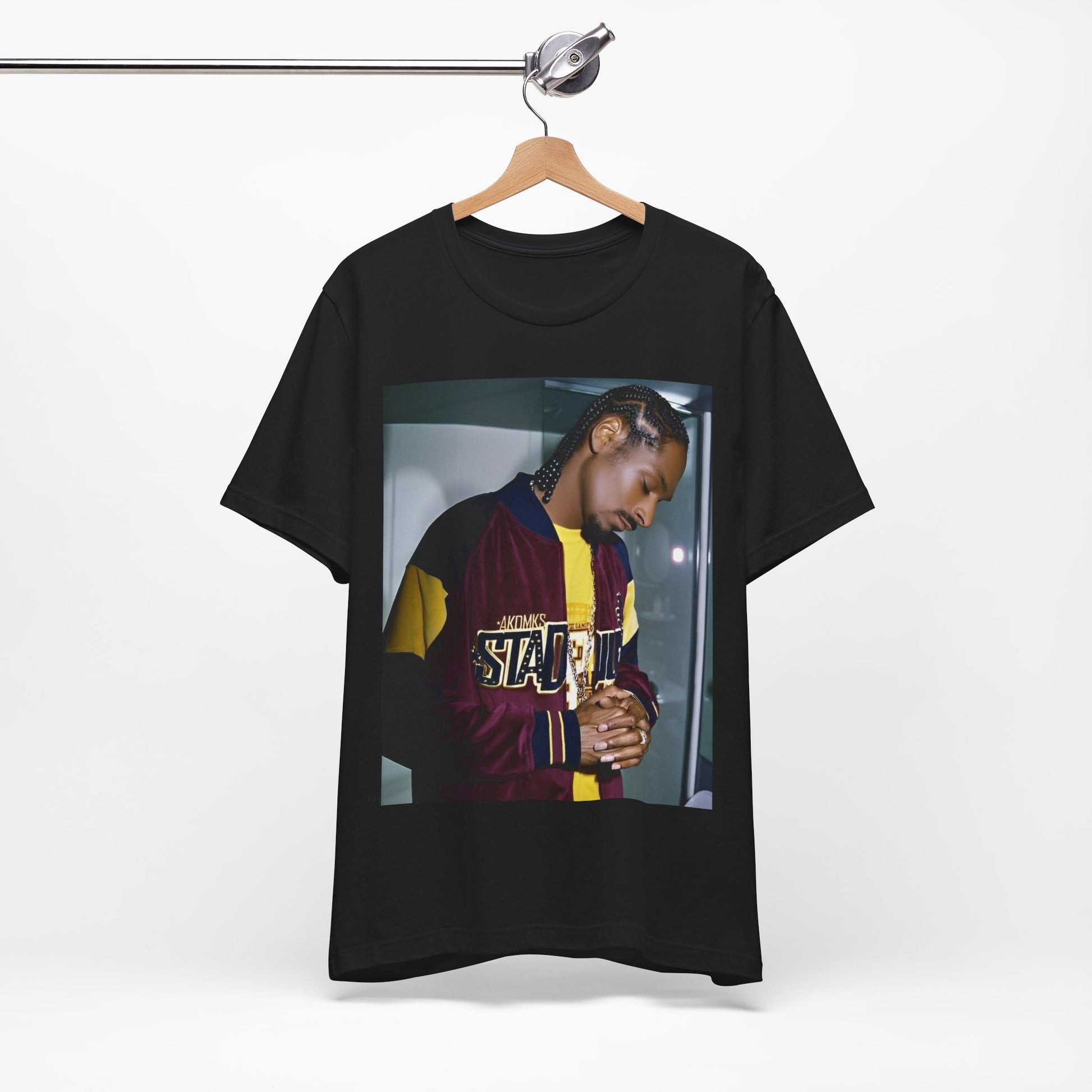 A black graphic t-shirt featuring a classic graphic of Snoop Dogg with a cool gaze.