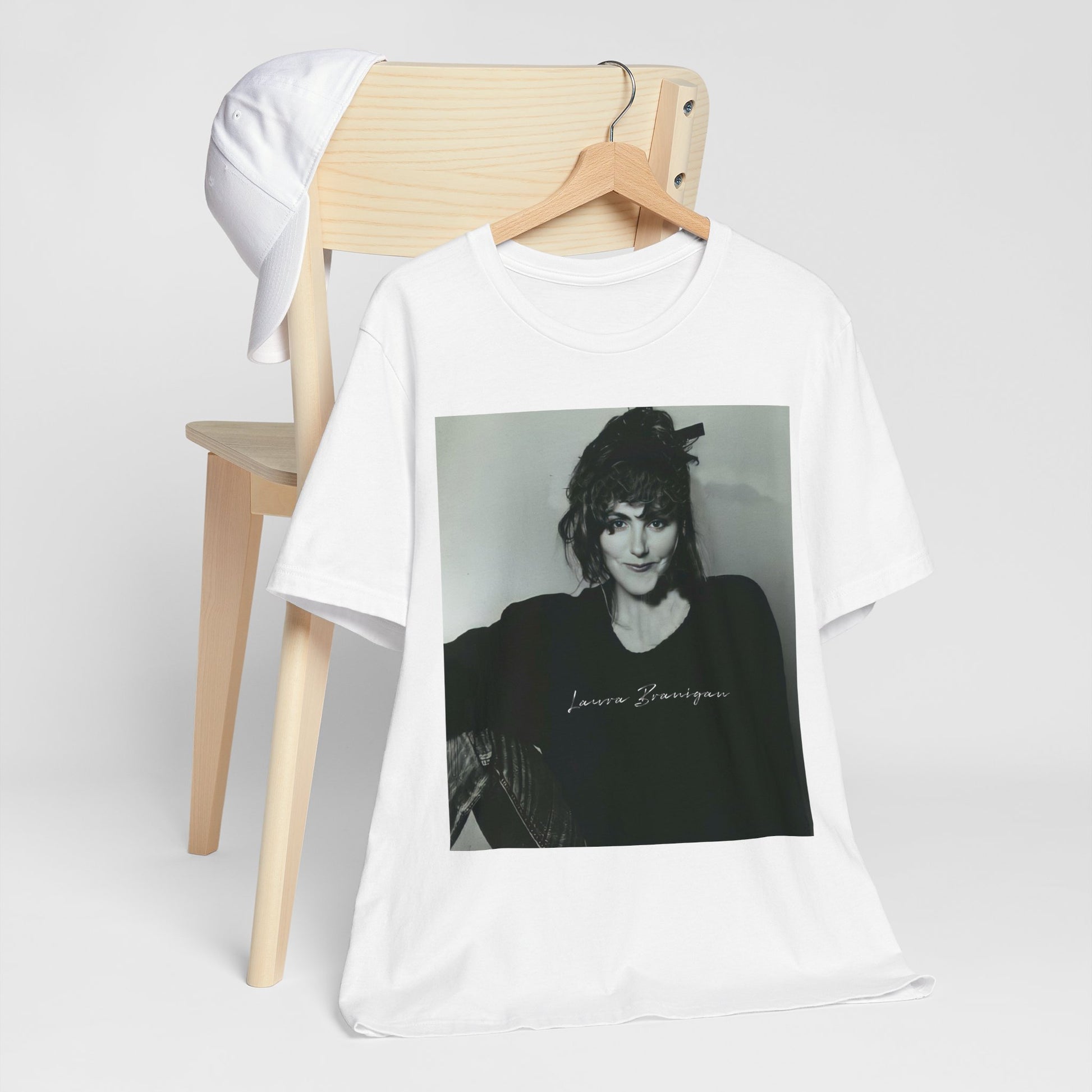 A black graphic t-shirt featuring a casual 80s pop fan graphic of Laura Branigan.