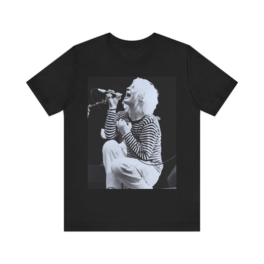 A black graphic t-shirt featuring a black and white graphic or photo of Radiohead performing live.