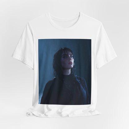 A direct, powerful portrait of Billie Eilish, embodying the 'HIT ME HARD AND SOFT' album era, printed on a graphic t-shirt.