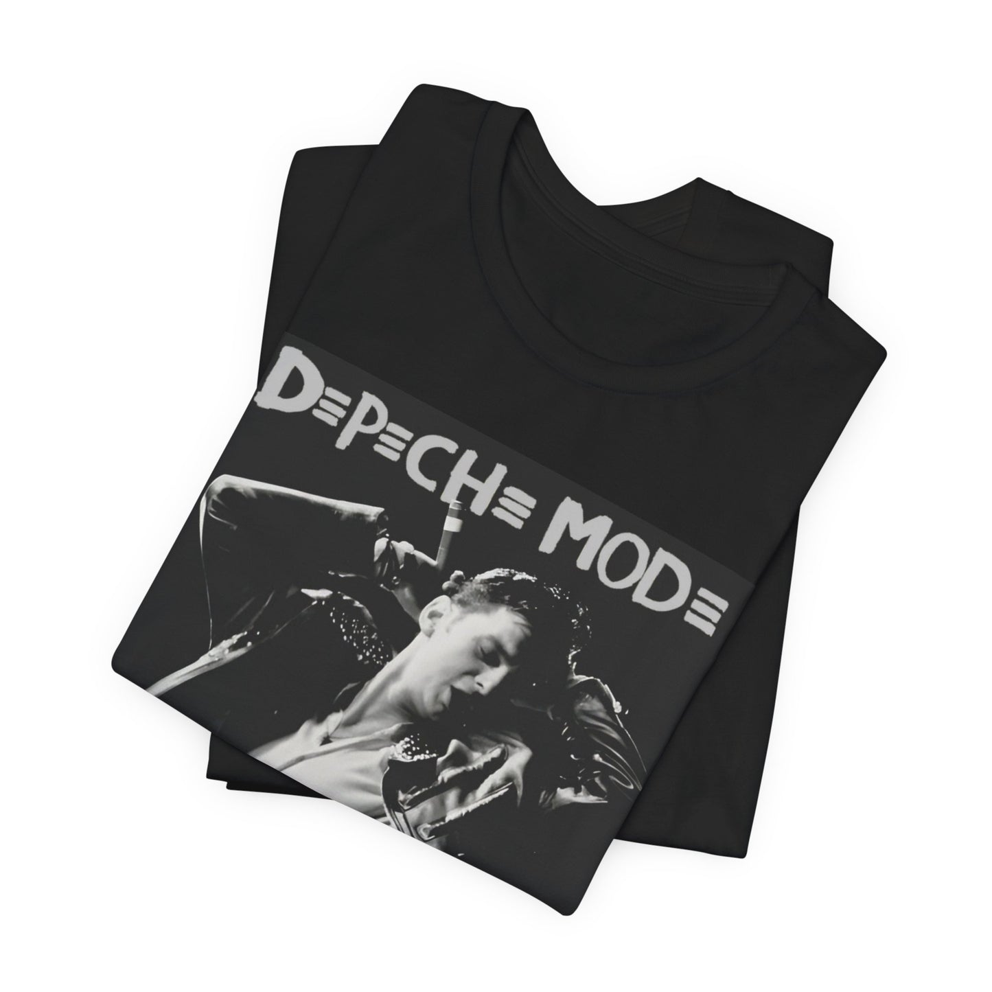A black graphic t-shirt featuring a black and white graphic or photo of Depeche Mode performing live on stage.