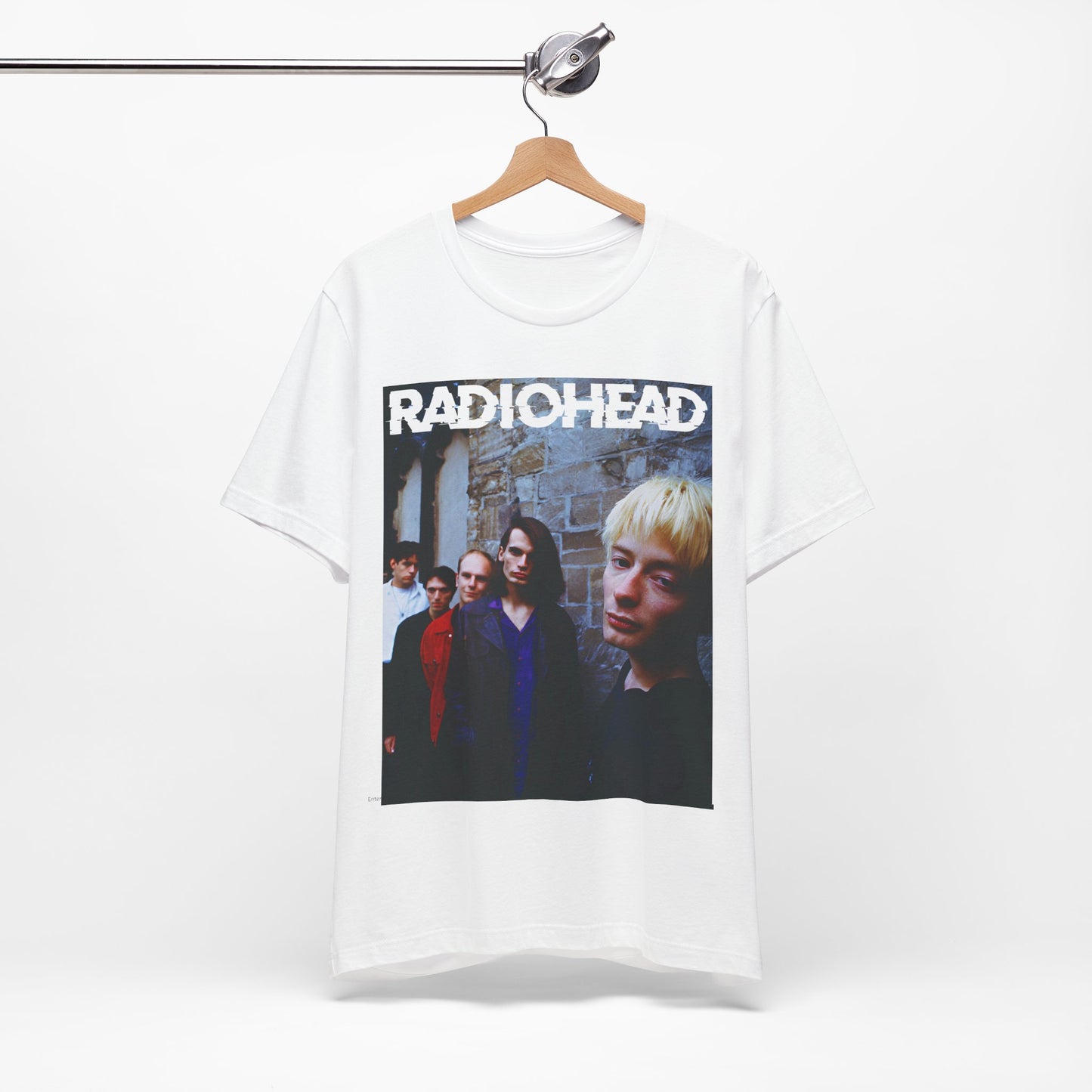 A black graphic t-shirt featuring a 90s graphic related to Radiohead's 'Karma Police' song or era.