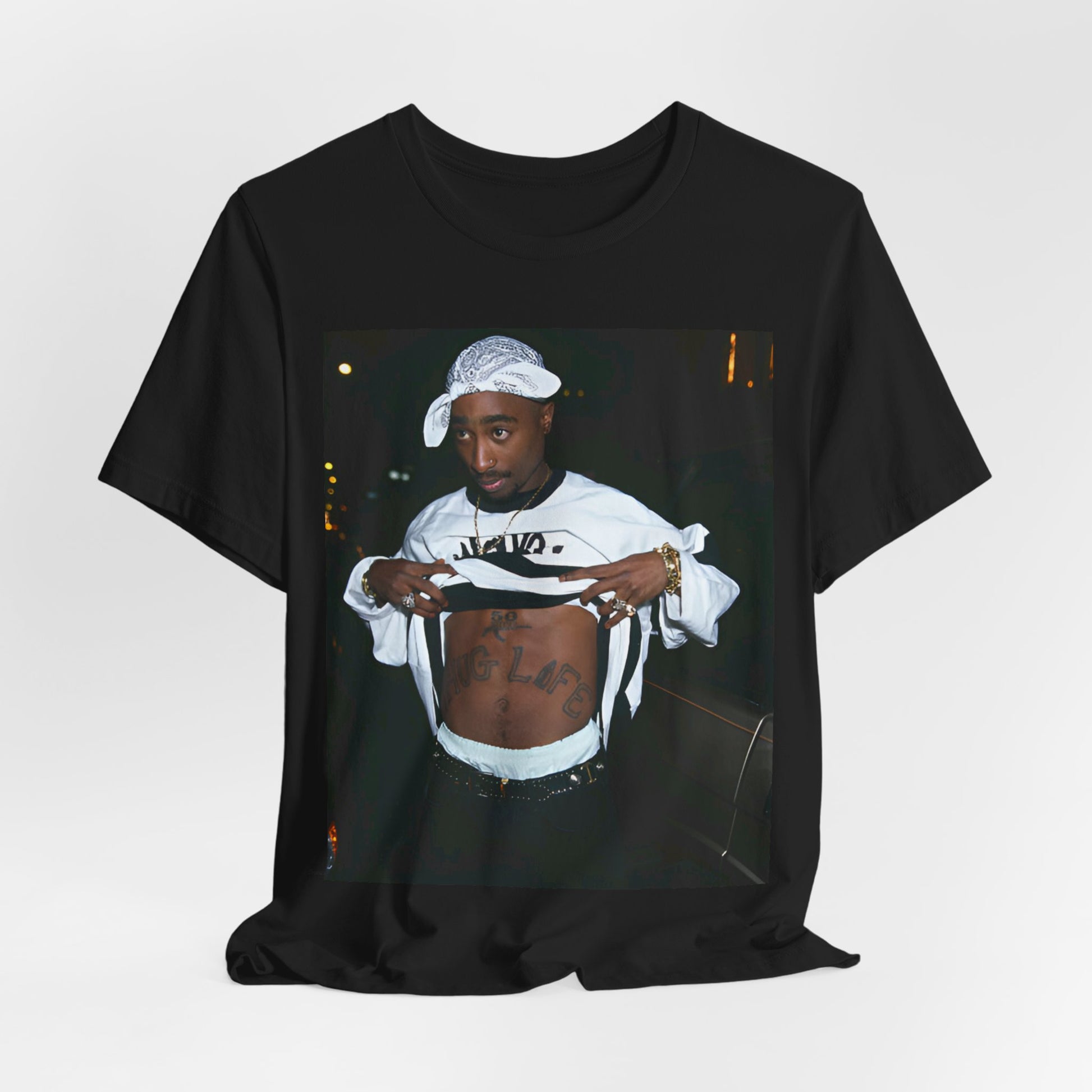 A black graphic t-shirt featuring a graphic of Tupac Shakur (2Pac).