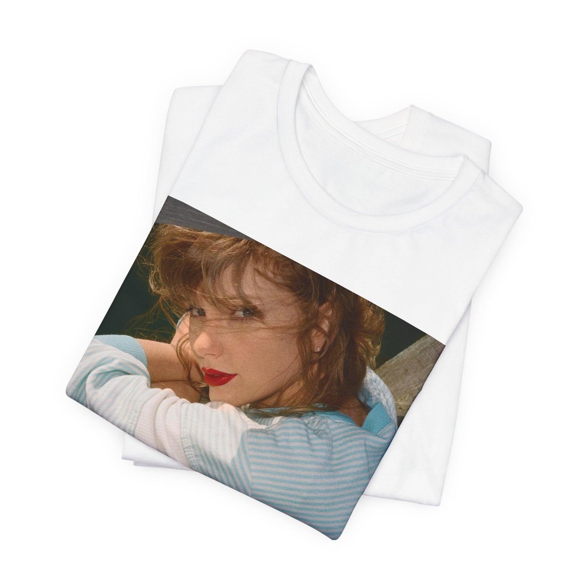 A black graphic t-shirt featuring a 1989 aesthetic graphic of Taylor Swift.
