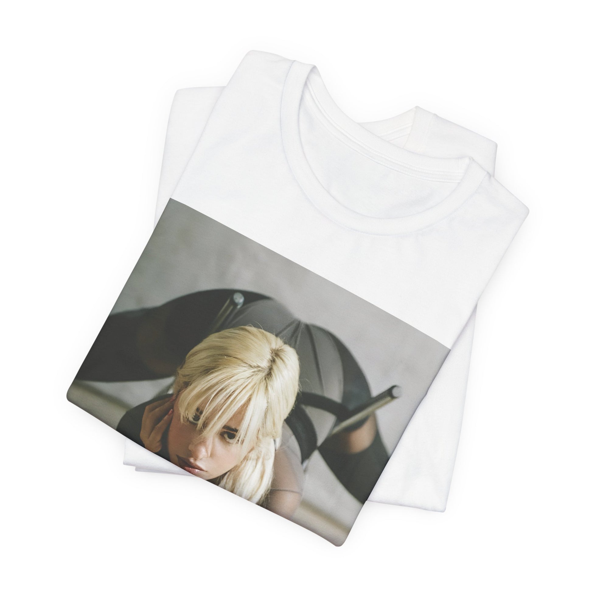 A black graphic t-shirt featuring a vintage-style graphic of Camila Cabello, possibly with a crown or 'Pop Queen' title.