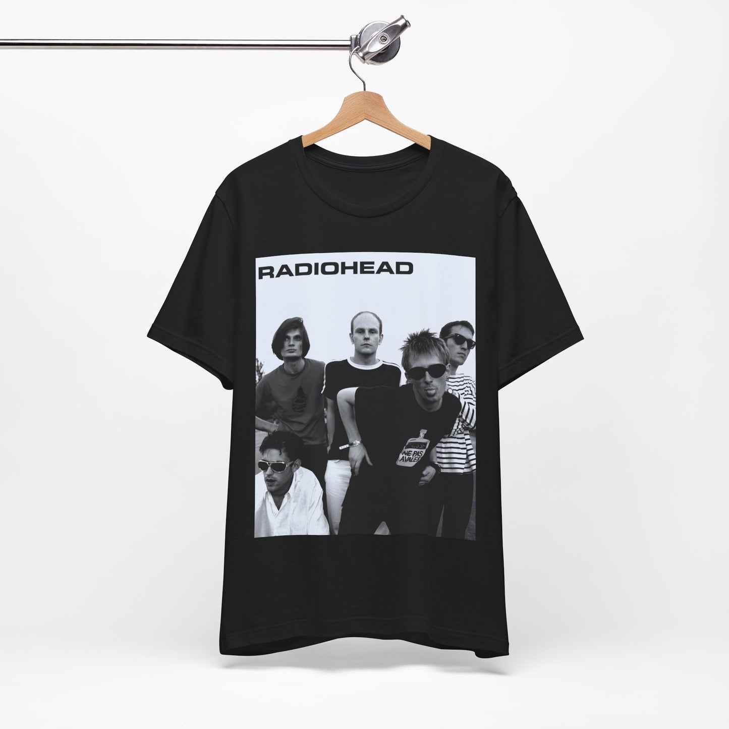 A black graphic t-shirt featuring a vintage 90s graphic related to Radiohead's 'Creep' song or era.