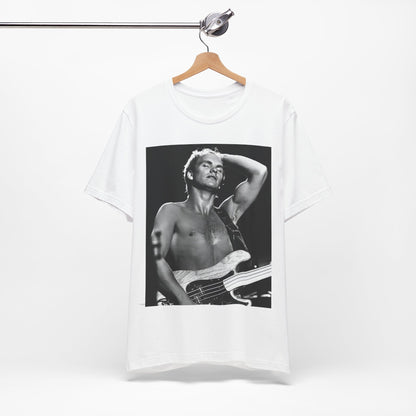 A black graphic t-shirt featuring a graphic or photo of Sting performing live on stage in 1983.