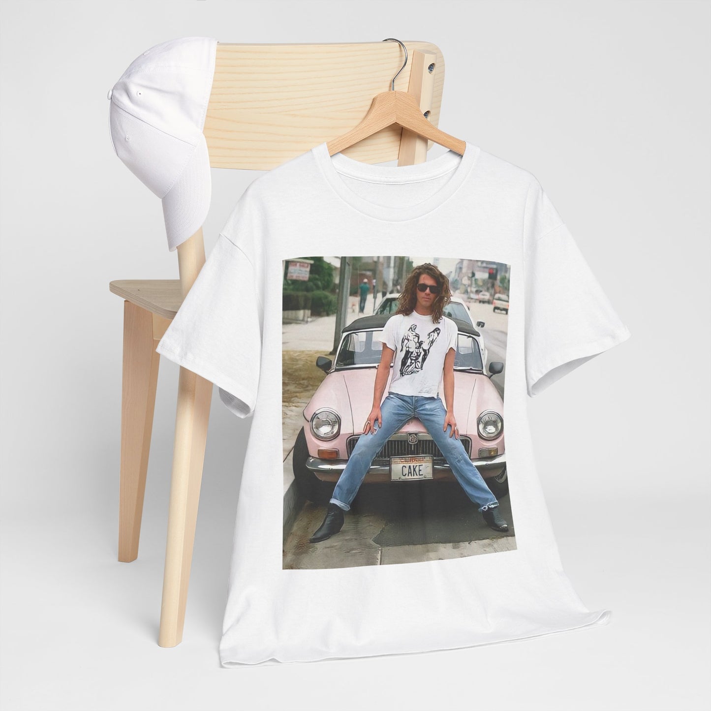 A black graphic t-shirt featuring a vintage photo of INXS band members with a classic car.