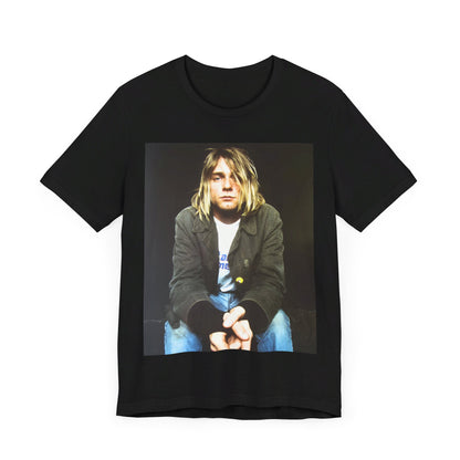 A black graphic t-shirt featuring an iconic graphic of Kurt Cobain from Nirvana.