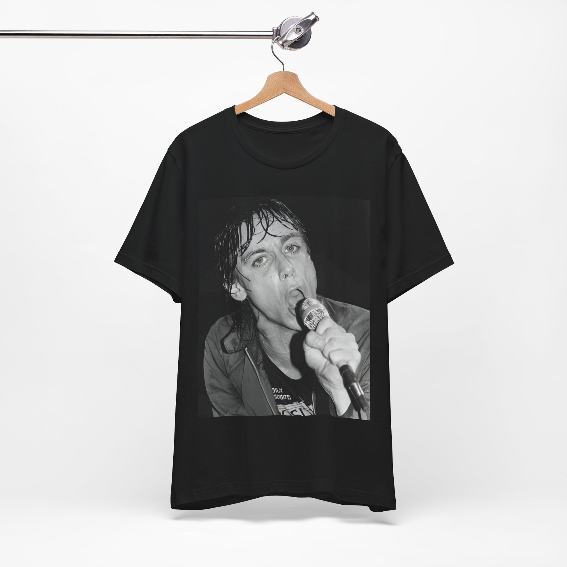 A black graphic t-shirt featuring a 70s graphic or photo of Iggy Pop performing in a wild concert.