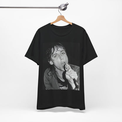 A black graphic t-shirt featuring a 70s graphic or photo of Iggy Pop performing in a wild concert.