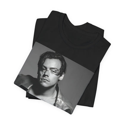 A black graphic t-shirt featuring a black and white portrait photo of Harry Styles.