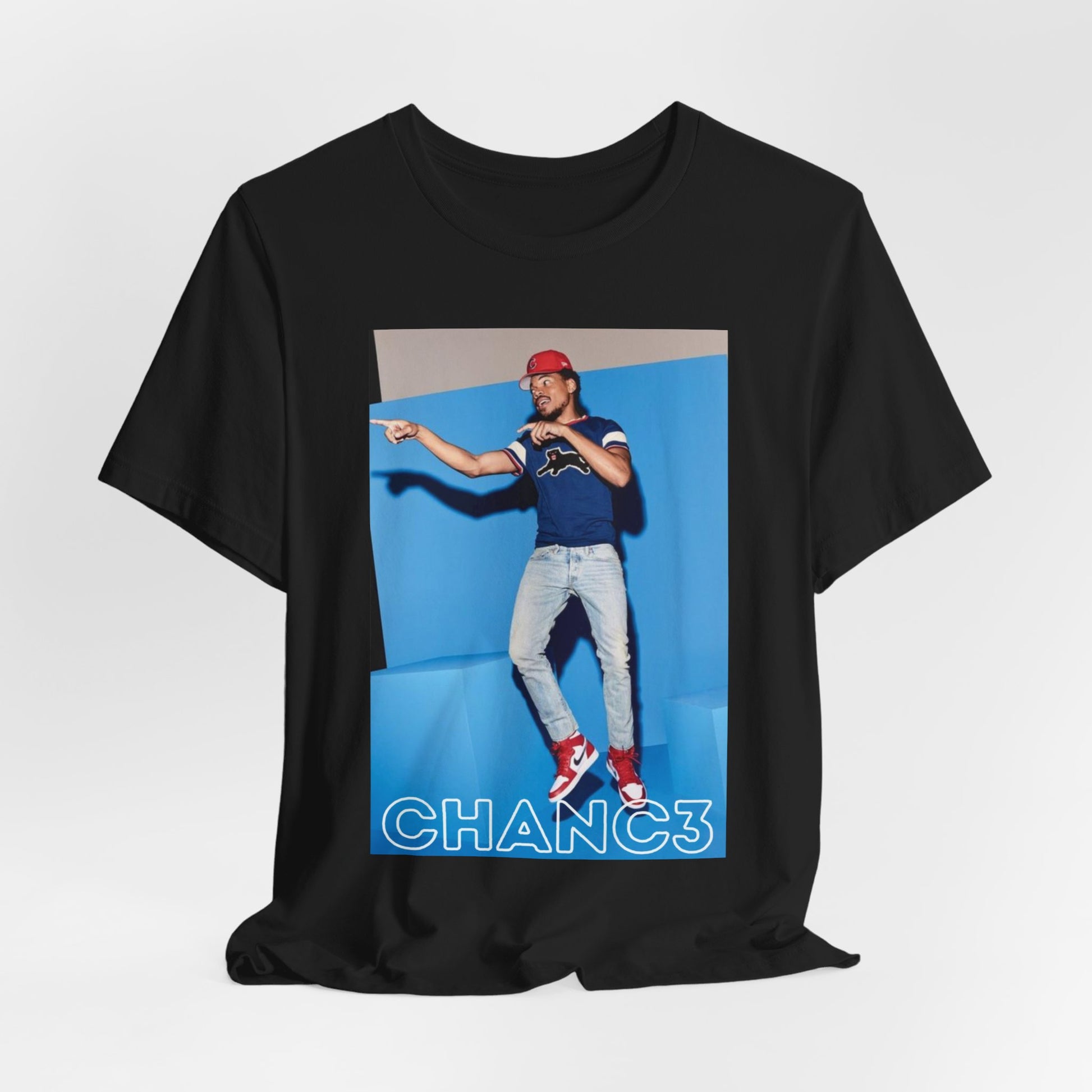 A black graphic t-shirt featuring a graphic of Chance the Rapper emphasizing his gospel rap style.