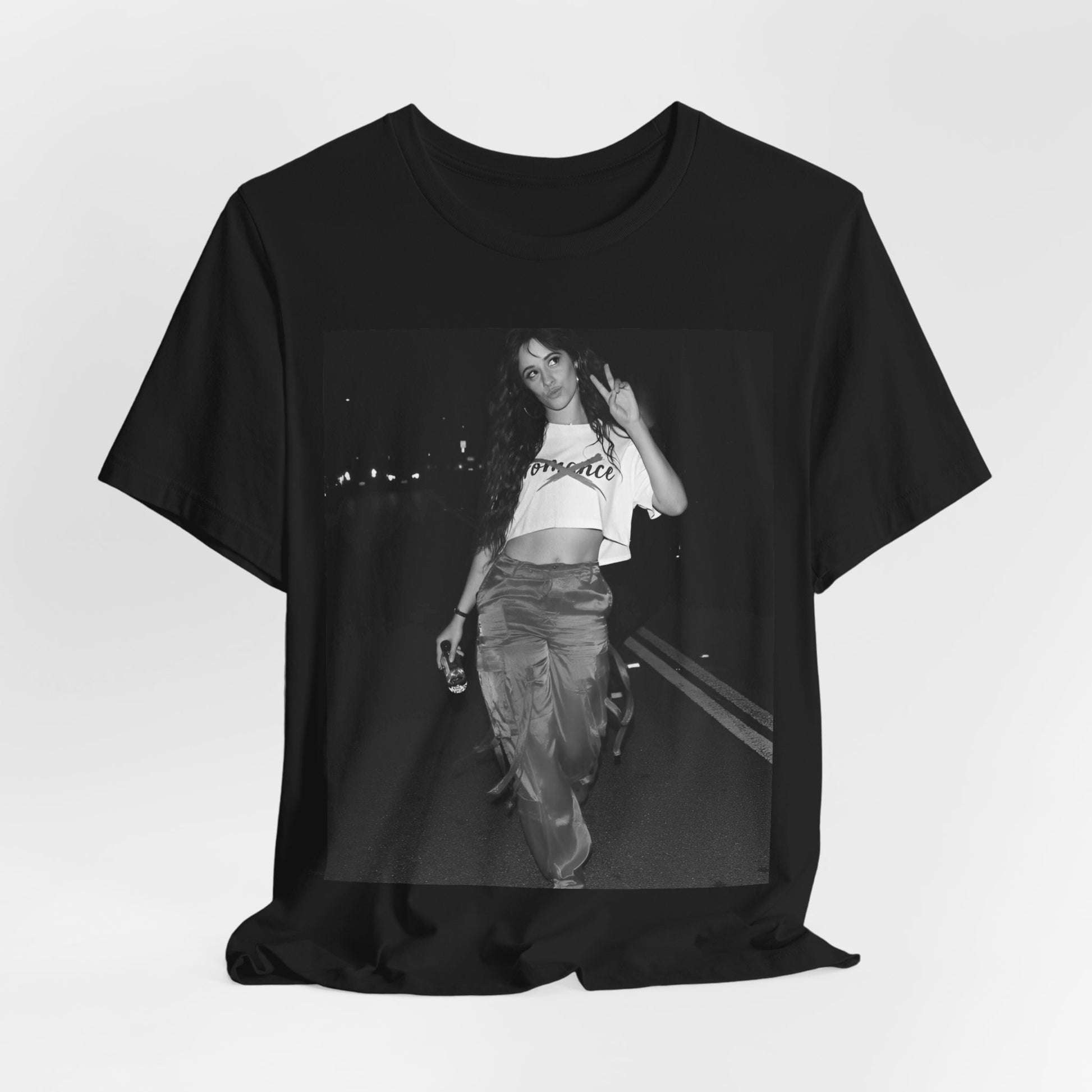 A black graphic t-shirt featuring a photo of Camila Cabello from her "Romance" album era.