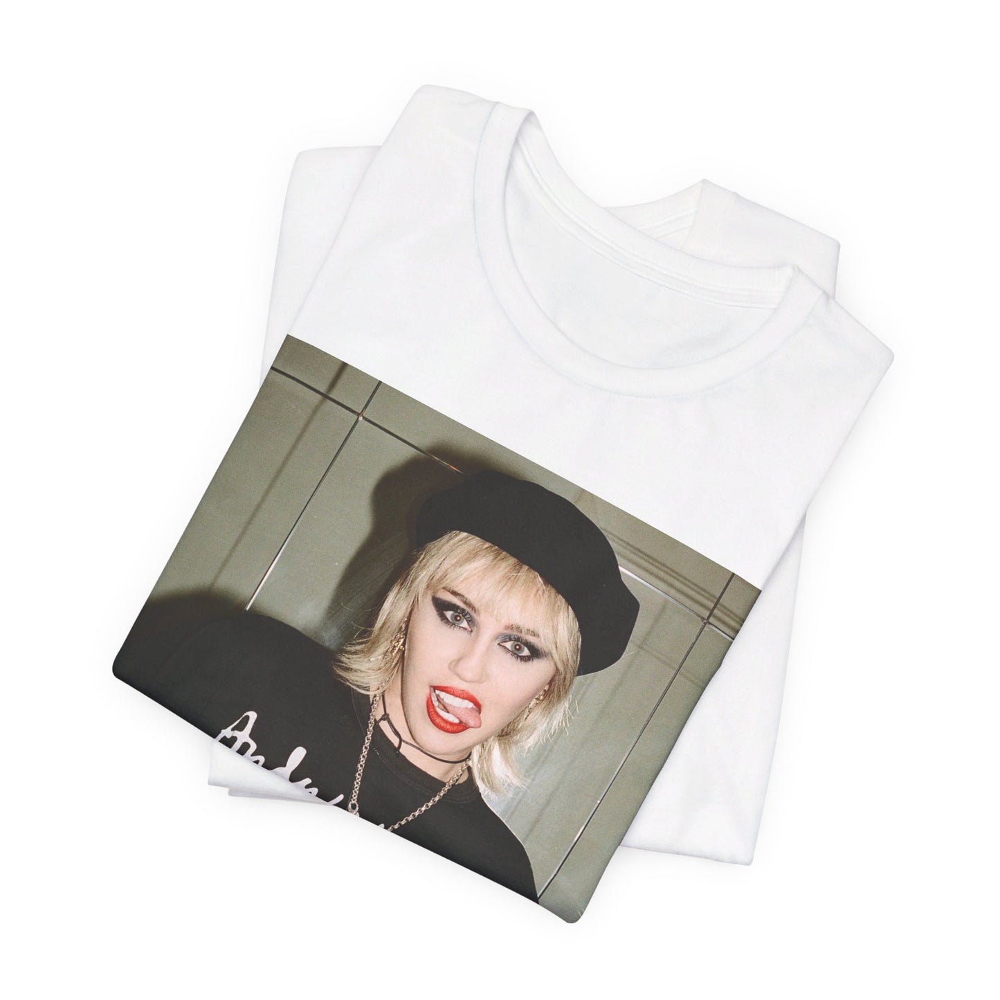 A black graphic t-shirt featuring a graphic related to Miley Cyrus' 'Bad Karma' era.
