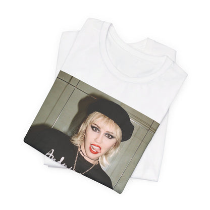 A black graphic t-shirt featuring a graphic related to Miley Cyrus' 'Bad Karma' era.