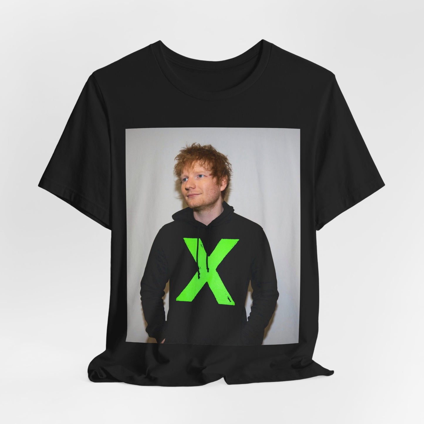 A black graphic t-shirt featuring an aesthetic graphic of Ed Sheeran related to his album 'X'.