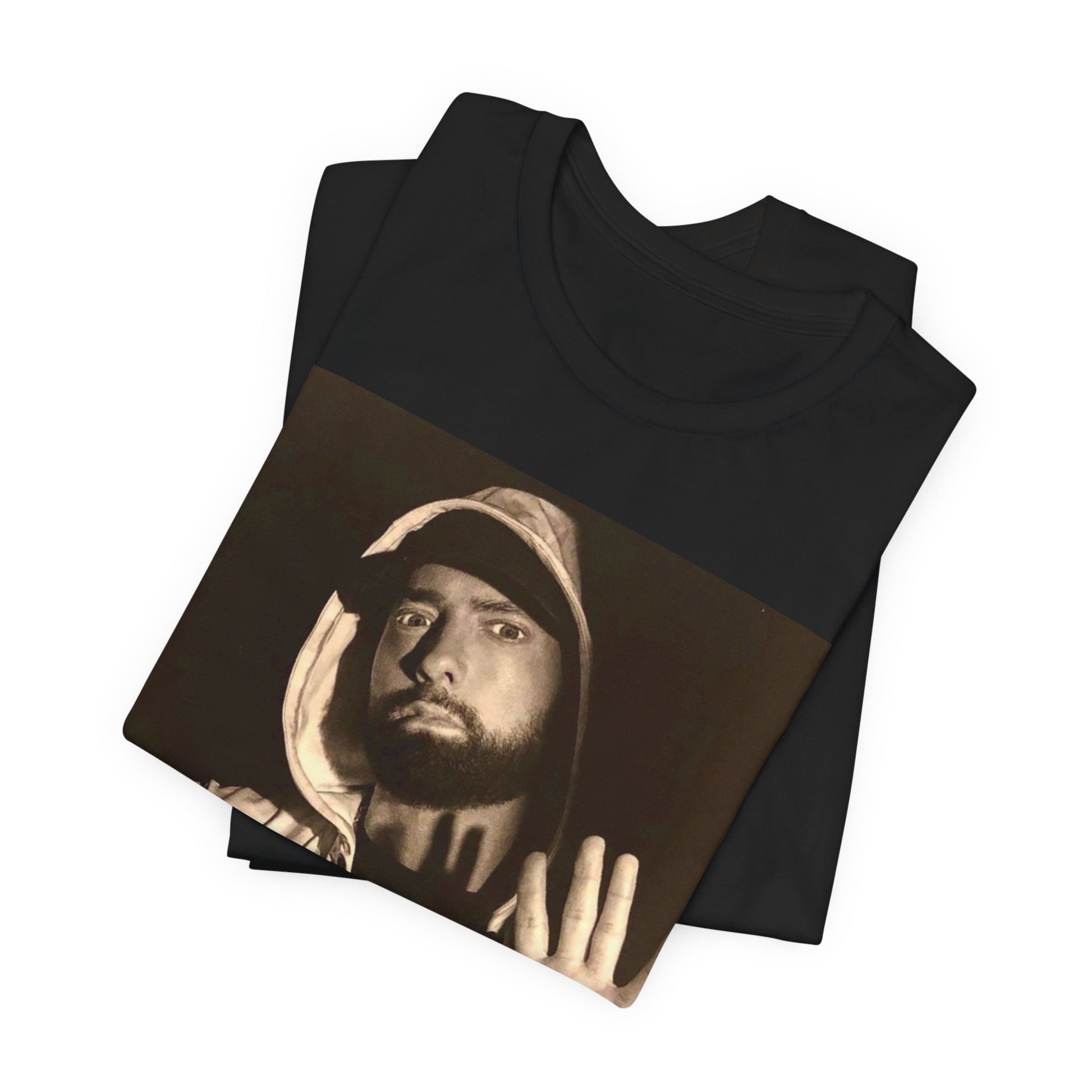 A black graphic t-shirt featuring a graphic of Eminem as an authentic underground rap icon.