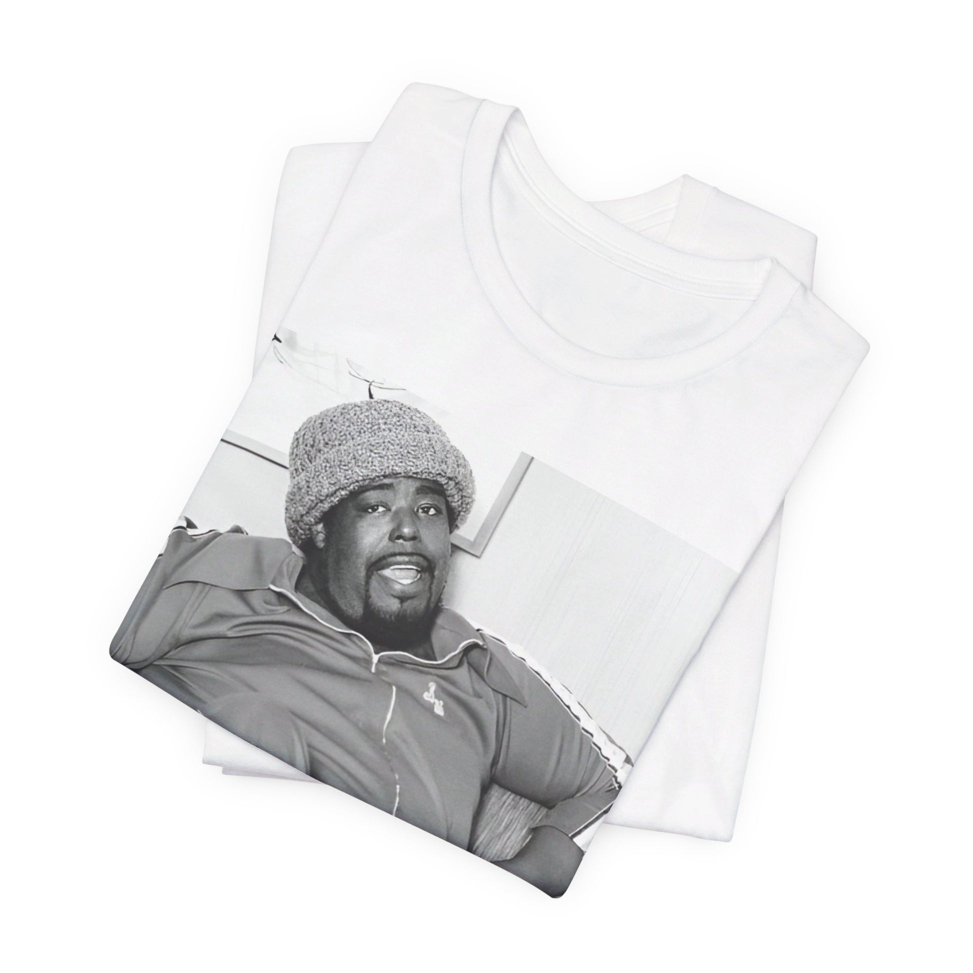 A black graphic t-shirt featuring a 70s-style portrait photo of Barry White in a lounge setting.
