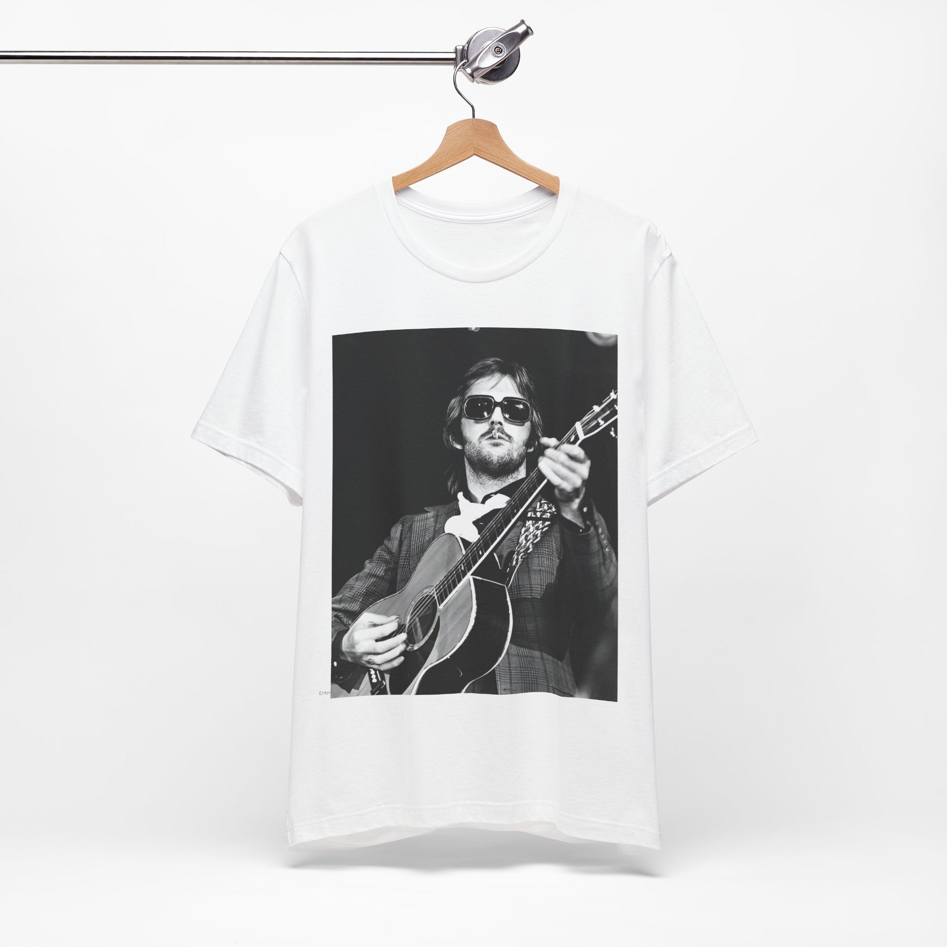 A black graphic t-shirt featuring a graphic of Eric Clapton with a chill blues rock vibe.