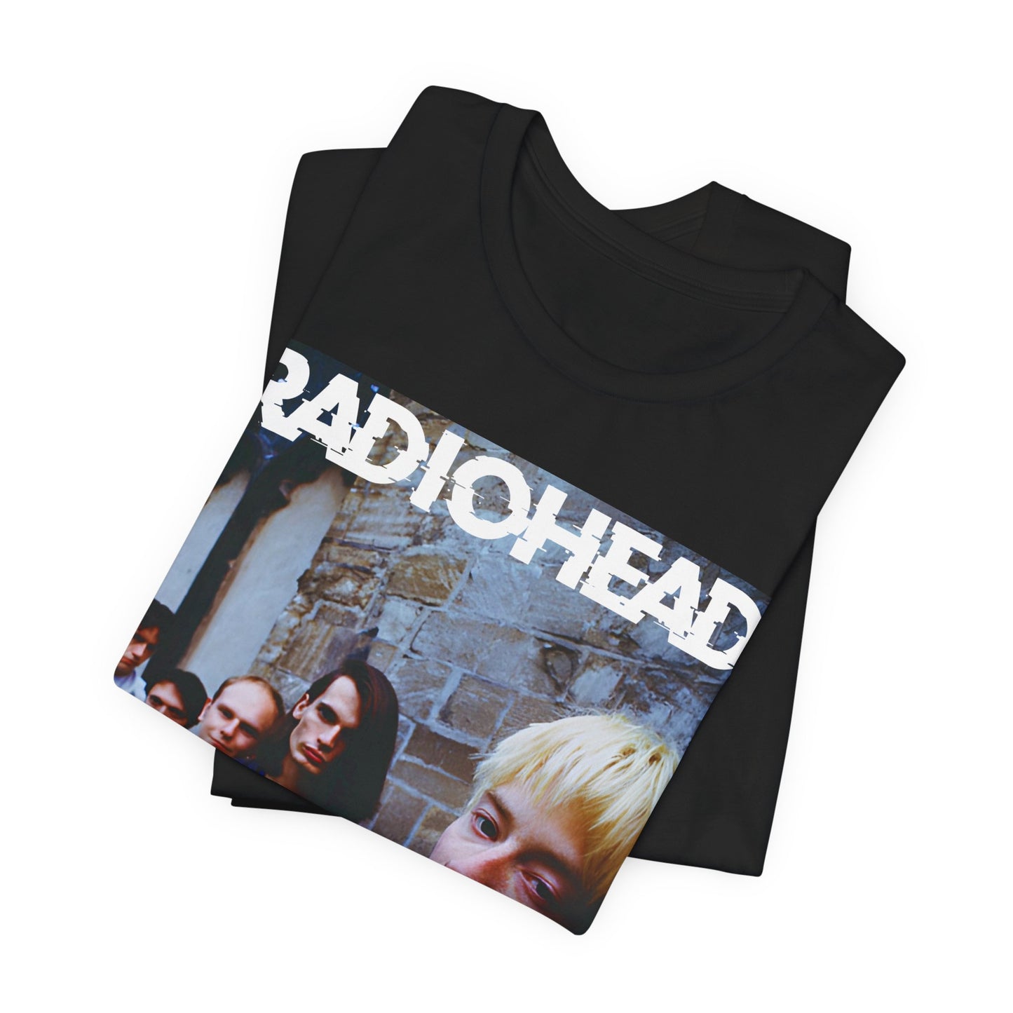 A black graphic t-shirt featuring a 90s graphic related to Radiohead's 'Karma Police' song or era.