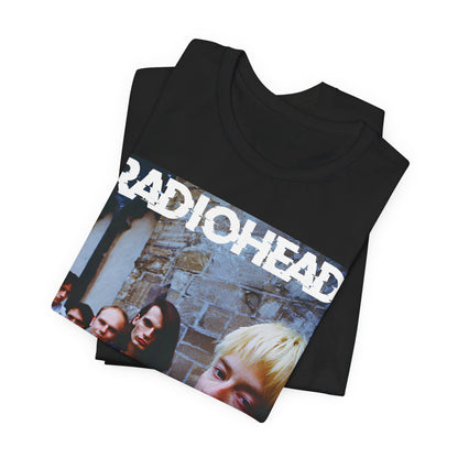 A black graphic t-shirt featuring a 90s graphic related to Radiohead's 'Karma Police' song or era.