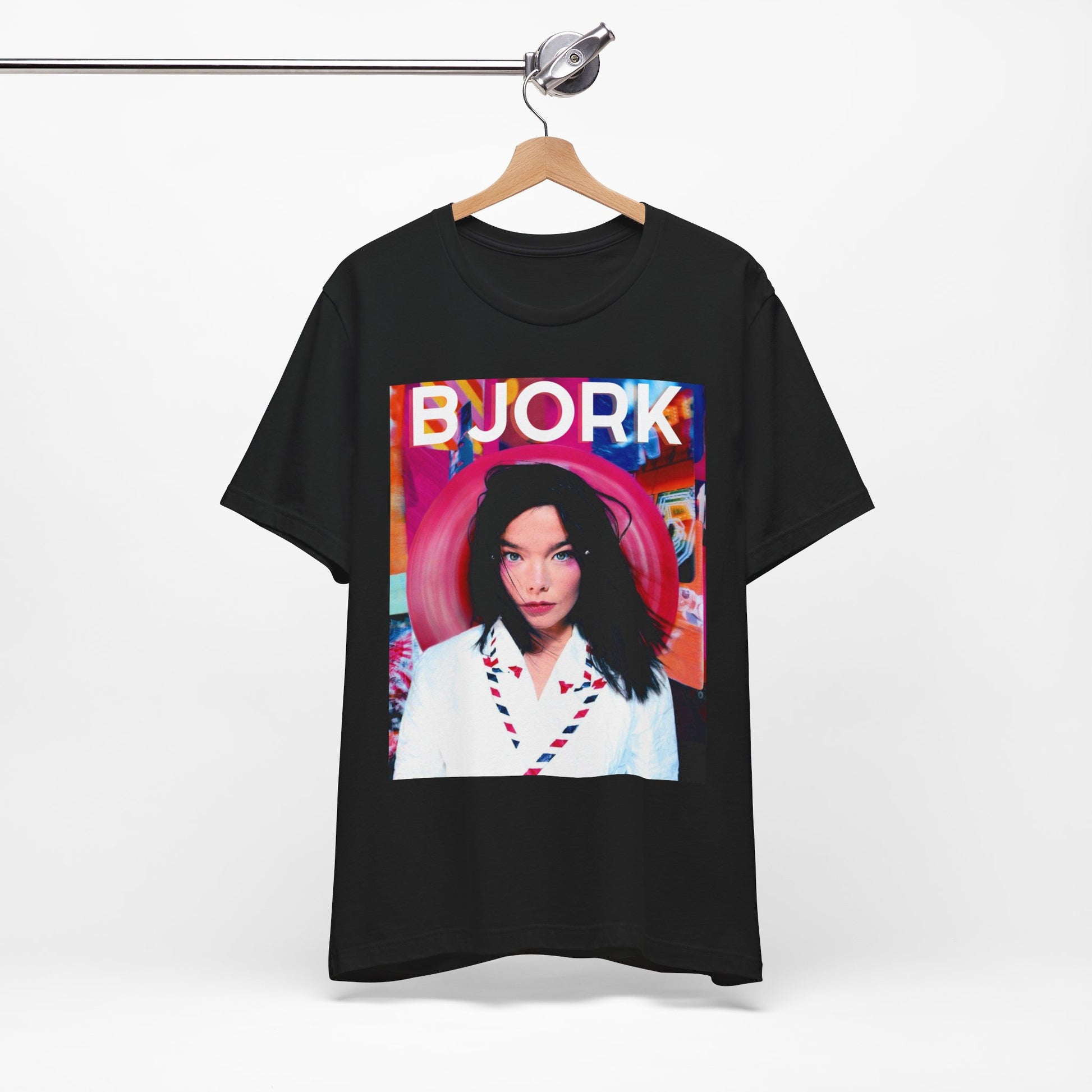 A black graphic t-shirt featuring an artistic or aesthetic pop art graphic of Bjork, with vibrant colors or bold lines.