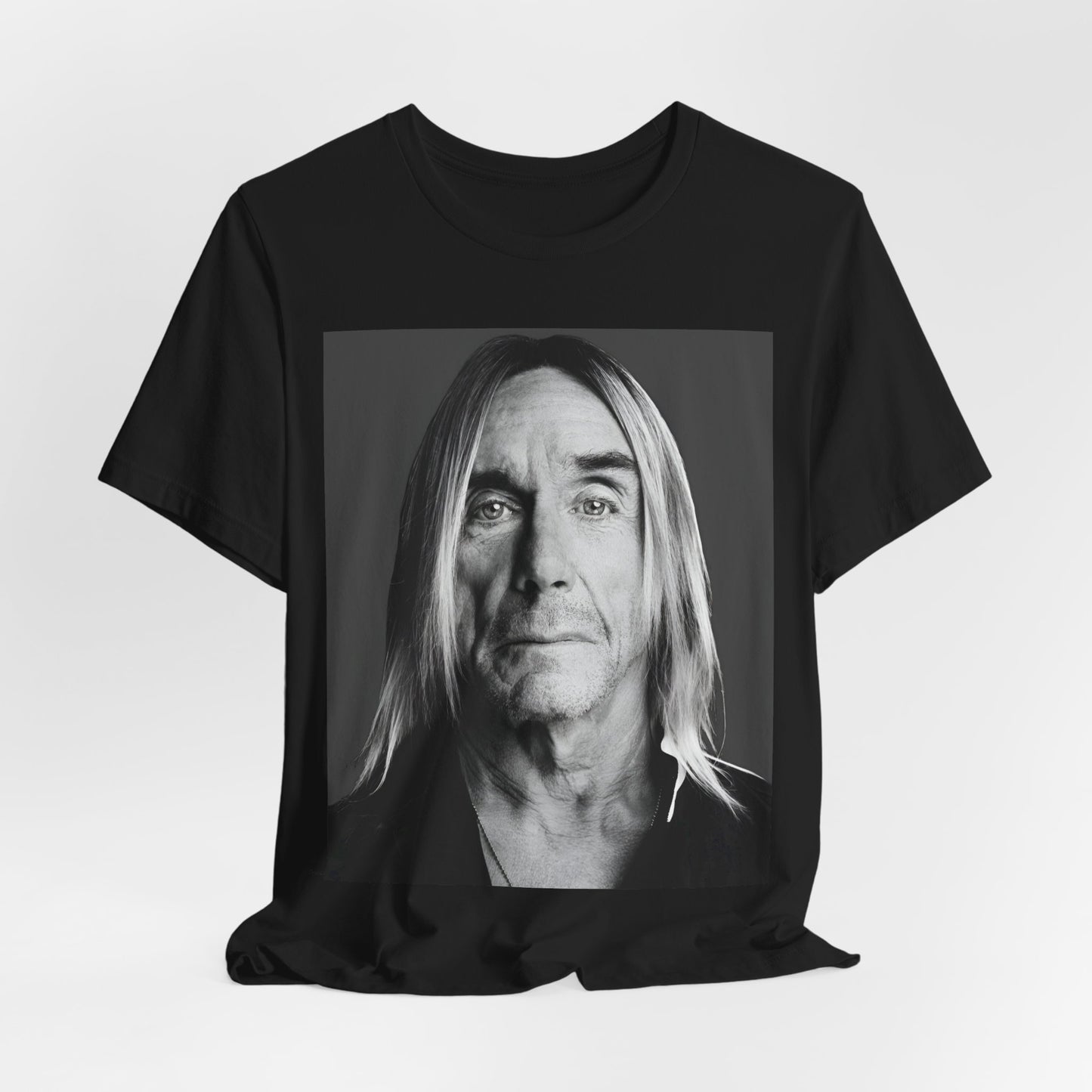 A black graphic t-shirt featuring a black and white portrait photo of Iggy Pop.