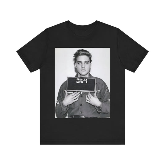 A black graphic t-shirt featuring a retro mugshot photo of Elvis Presley.