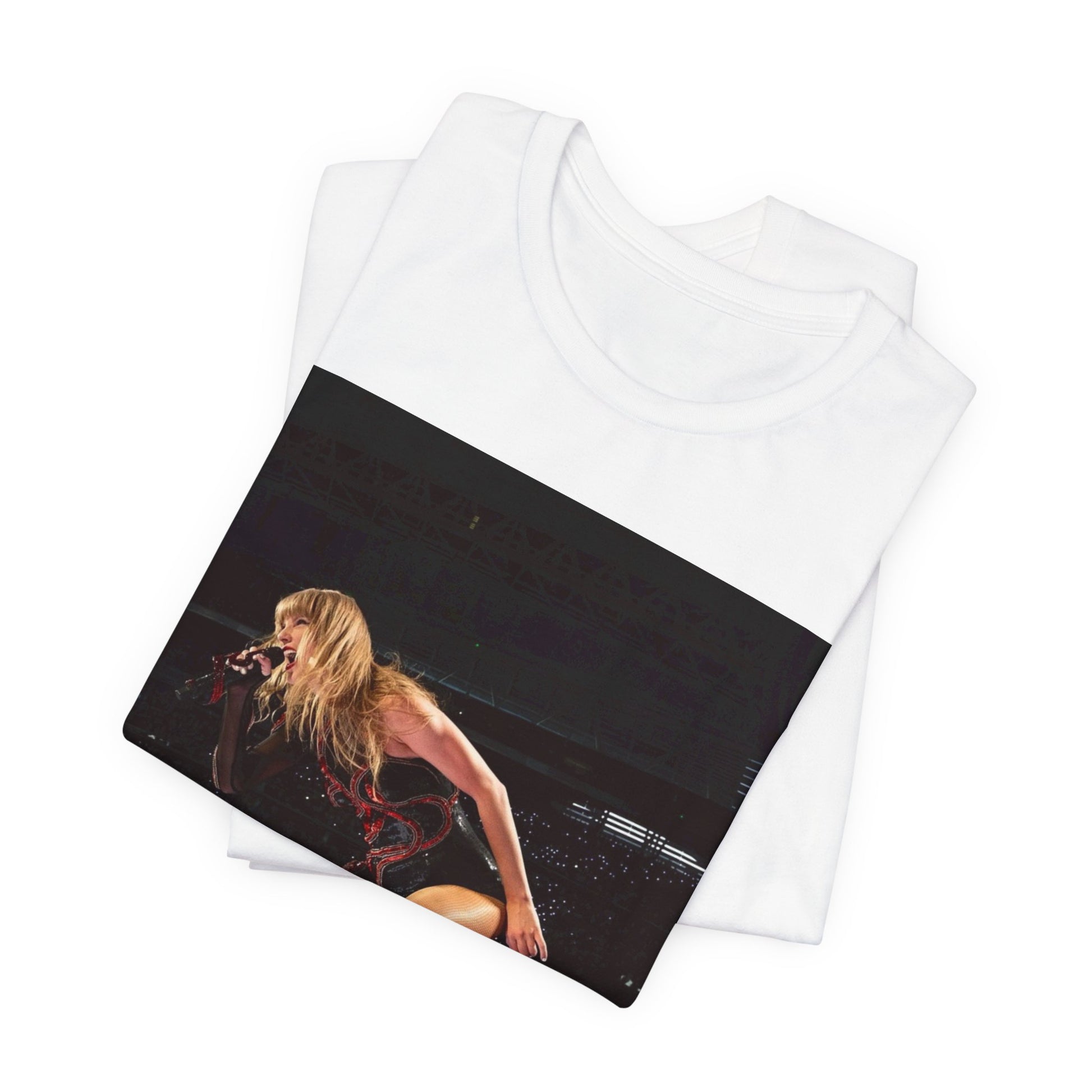 A black graphic t-shirt featuring a fierce graphic of Taylor Swift on stage.