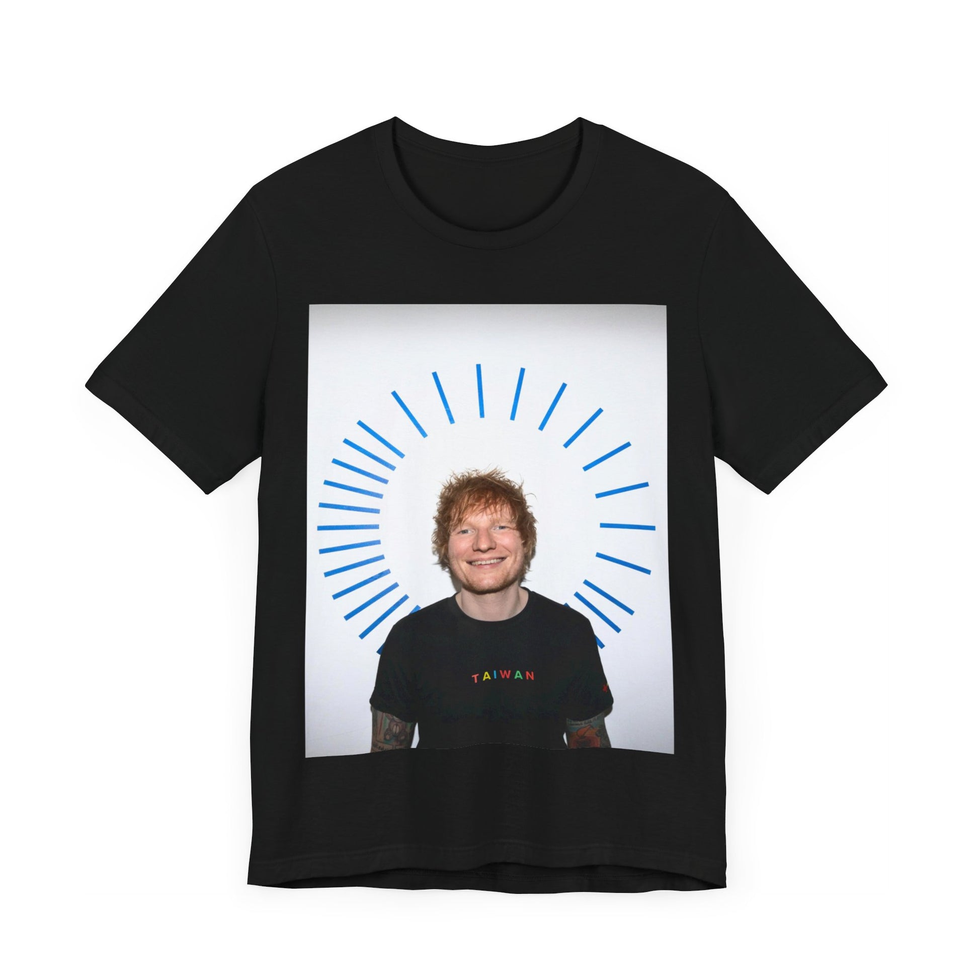 A black graphic t-shirt featuring a classic photo portrait of Ed Sheeran in a folk-pop style.