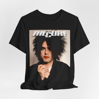 A black graphic t-shirt featuring a 90s portrait photo of Robert Smith from The Cure.