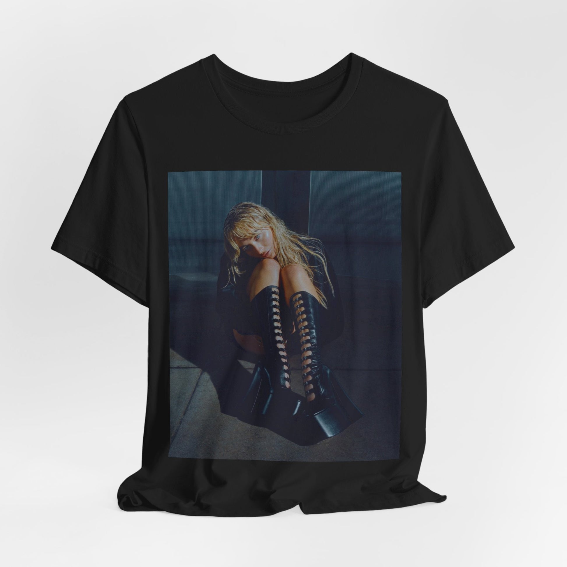 A black graphic t-shirt featuring a bold graphic of Sabrina Carpenter as a pop superstar.