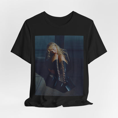 A black graphic t-shirt featuring a bold graphic of Sabrina Carpenter as a pop superstar.