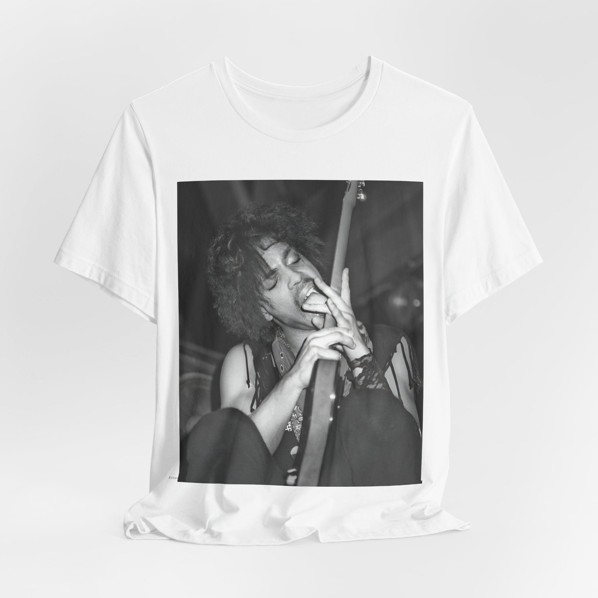 A black graphic t-shirt featuring a graphic or photo of Prince performing wildly on stage.