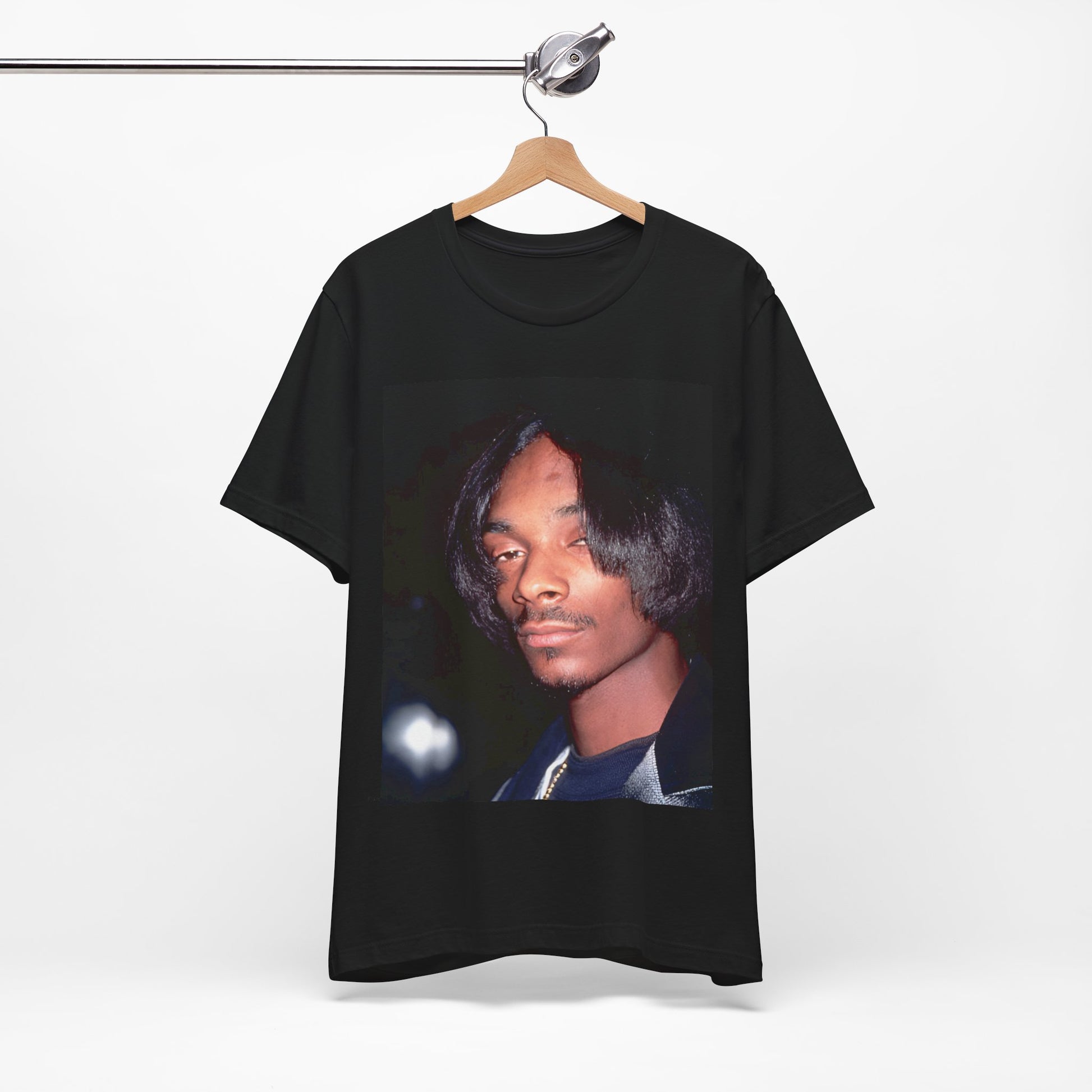 A black graphic t-shirt featuring a 90s black and white graphic of Snoop Dogg as a global icon in rap.