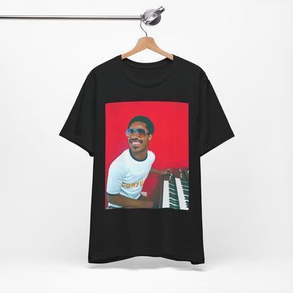 A black graphic t-shirt featuring a graphic of Stevie Wonder with a piano.