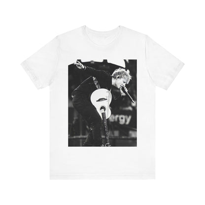 A black graphic t-shirt featuring a vintage graphic of Ed Sheeran performing live.