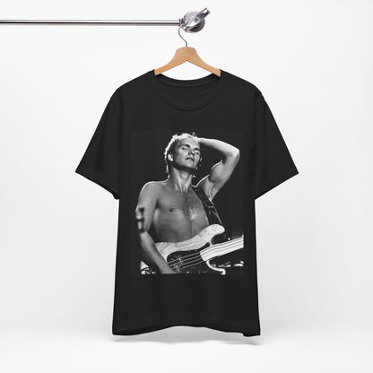 A black graphic t-shirt featuring a graphic or photo of Sting performing live on stage in 1983.