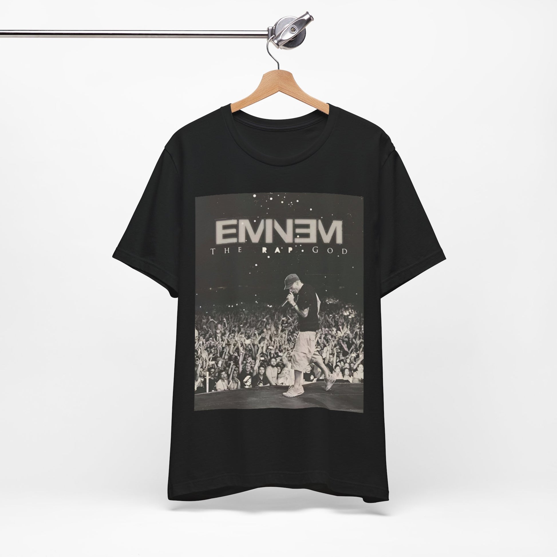 A black graphic t-shirt featuring a graphic or photo of Eminem performing live on tour.