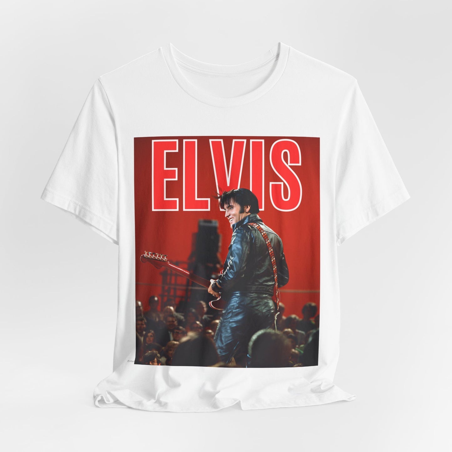 A black graphic t-shirt featuring a vintage graphic of Elvis Presley as the King of Rock 'n' Roll.