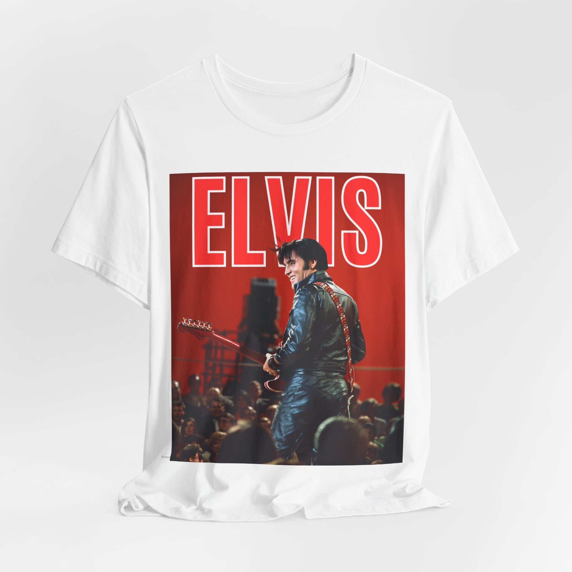 A black graphic t-shirt featuring a vintage graphic of Elvis Presley as the King of Rock 'n' Roll.