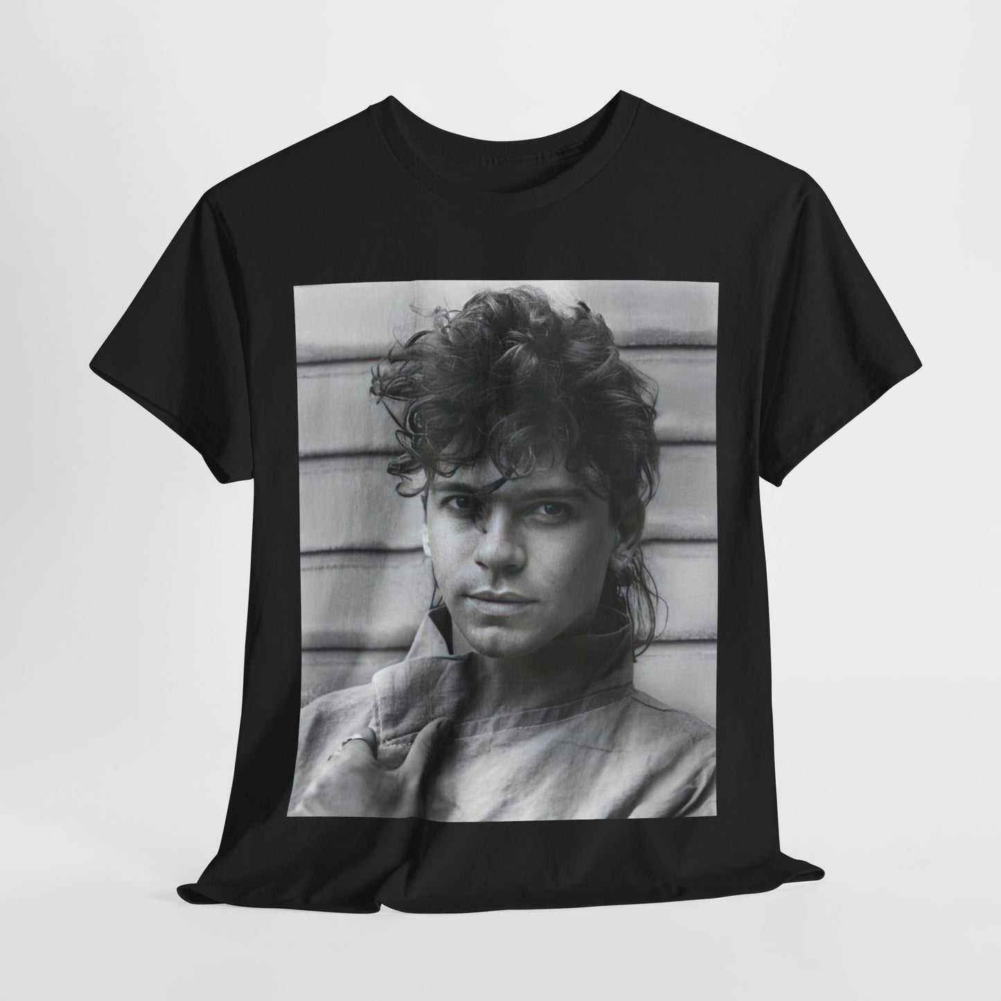 A black graphic t-shirt featuring a retro black and white graphic or photo of Michael Hutchence from INXS.
